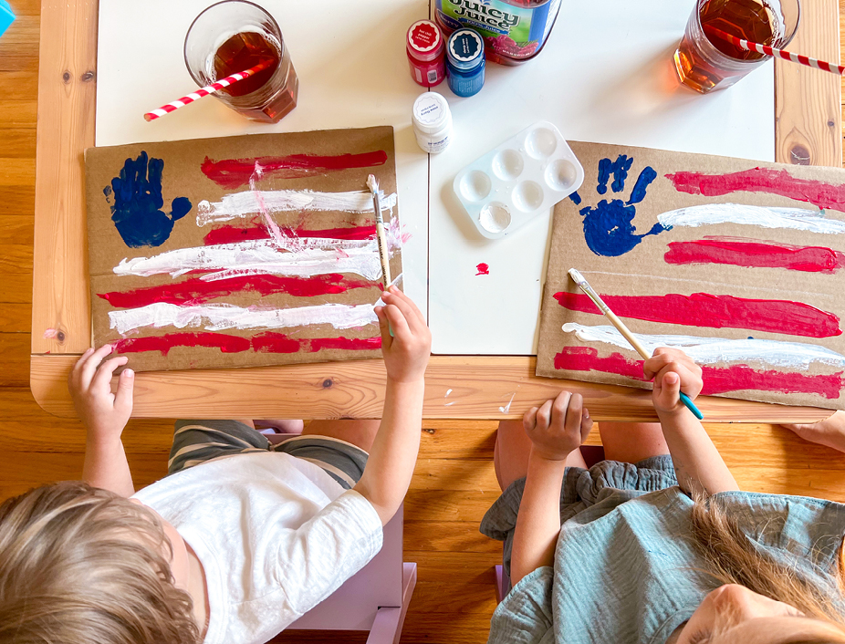 Using the white paint to  add white stripes and make a flag