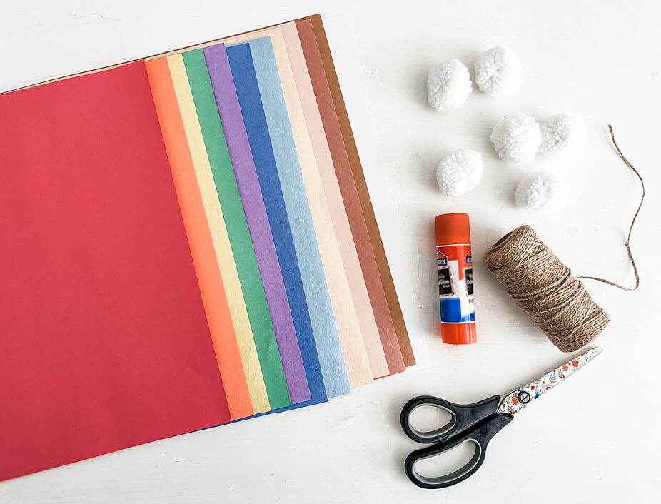 Construction paper, white pom poms, string and materials needed for the pie garland